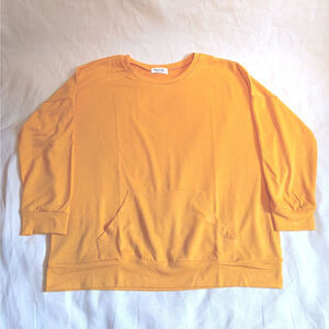 Mustard women's pullover with front pocket